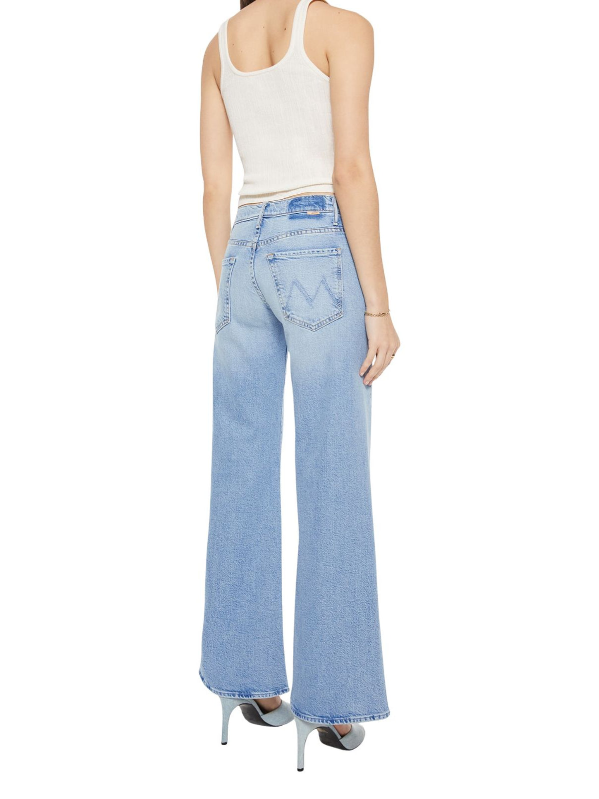 MOTHER The Mid Rise Sidestepper Twist Sneak Jeans in So Surreal