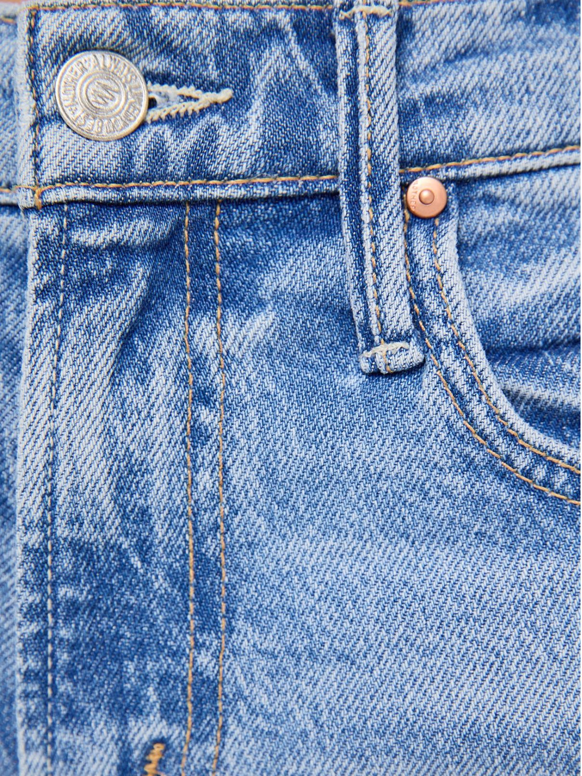 MOTHER The Mid Rise Sidestepper Twist Sneak Jeans in So Surreal
